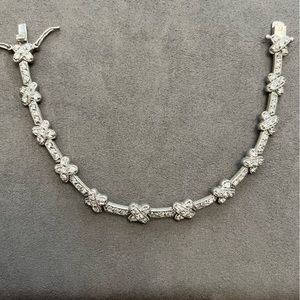 Cubic zirconia silver tennis bracelet with cross design